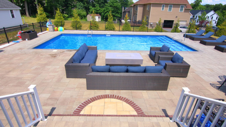 inground pool with outdoor furniture